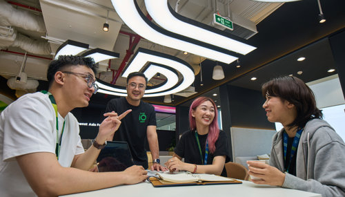 a group of people sitting around a table