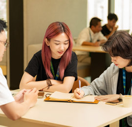 a group of people sitting at a table