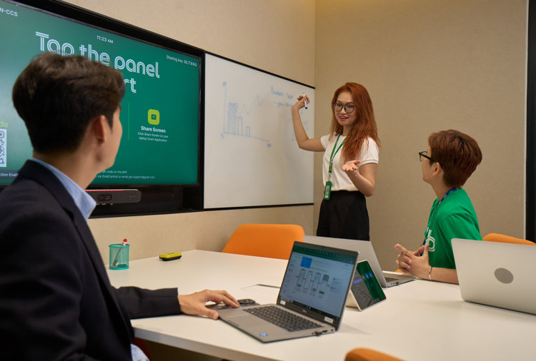 a person standing in front of a whiteboard