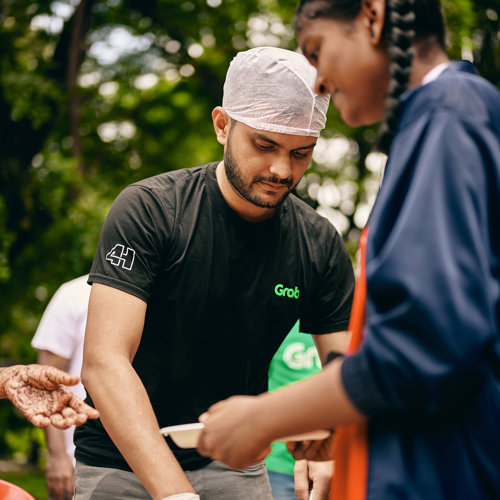 a man wearing a white cap and a black shirt