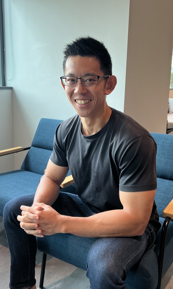 a person sitting on a blue chair