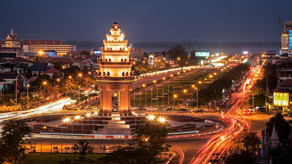 a large tower with lights on top of it with Country Club Plaza in the background