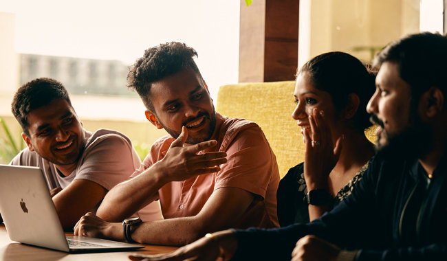 a group of people sitting at a table