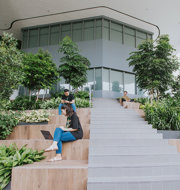 a group of people sitting on stairs outside a building