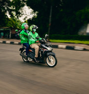two people riding a motorcycle
