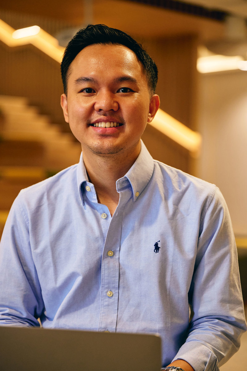 a man smiling at the camera