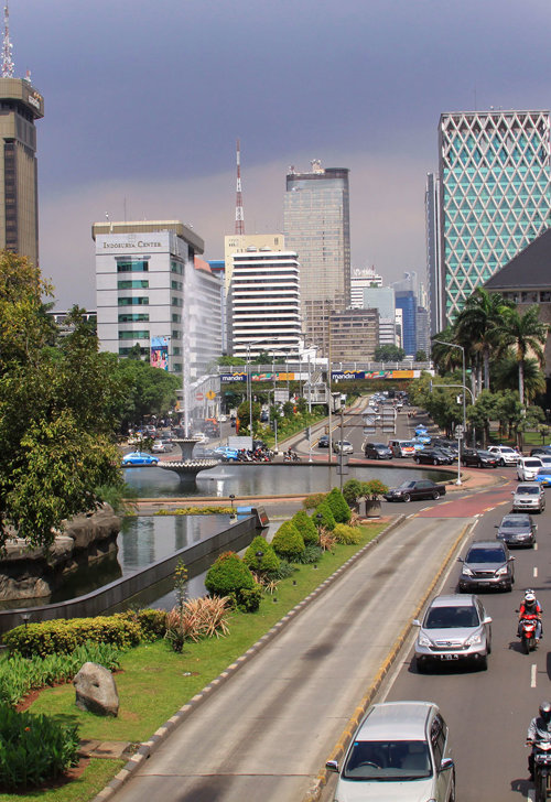a city street with cars and buildings