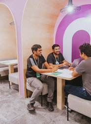 a group of men sitting at a table