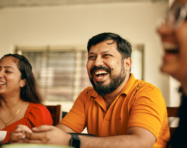 a man laughing at another man