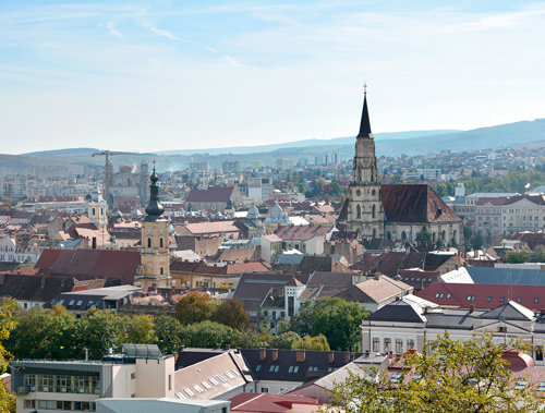 a city with a steeple and buildings