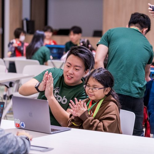 a group of people clapping hands