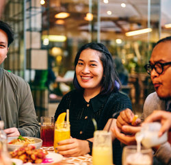a group of people sitting at a table
