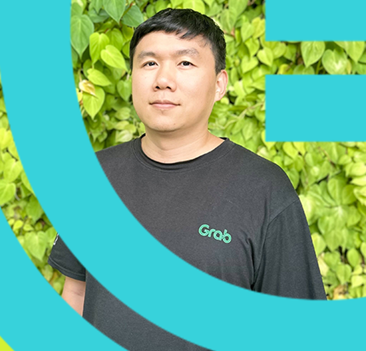 a person standing in front of a green bush