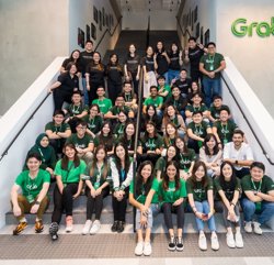 a group of people posing for a photo on stairs