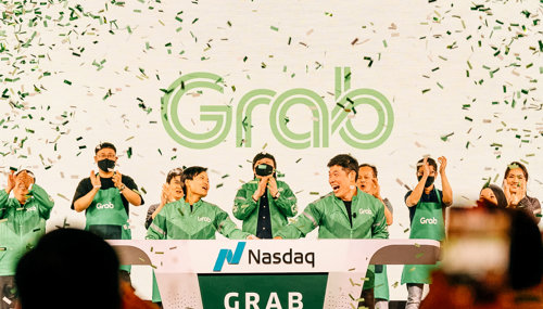 a group of people standing on a podium with confetti
