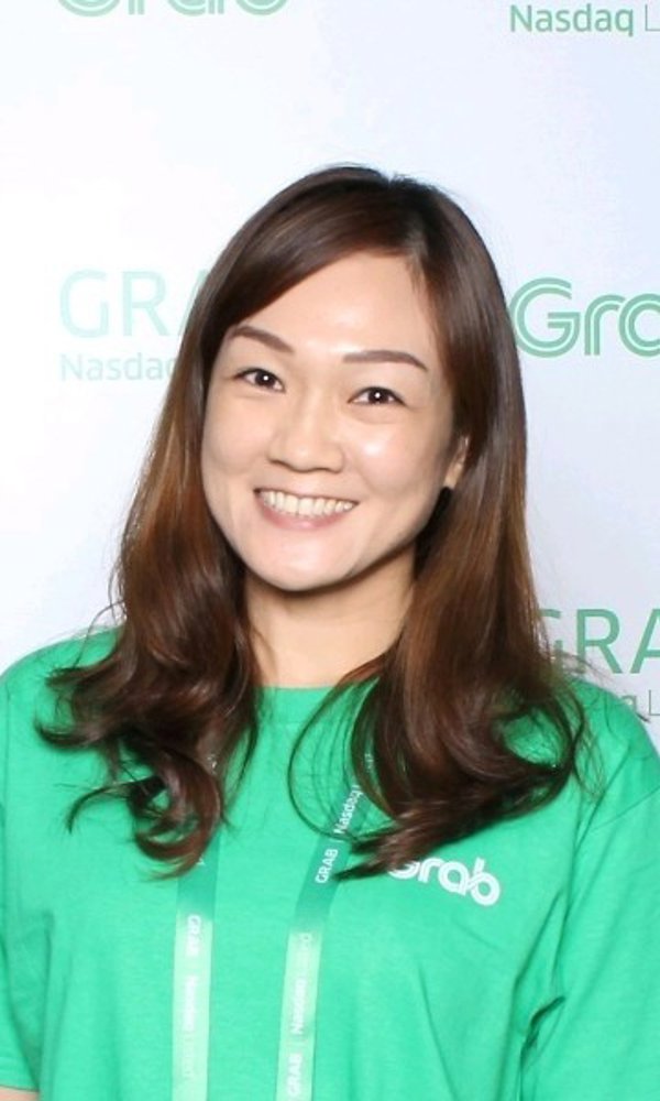 a woman in a green shirt