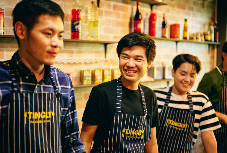 a group of people wearing aprons
