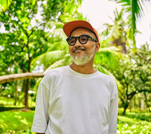 a man in a white shirt and red hat