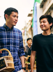 two men walking down a street