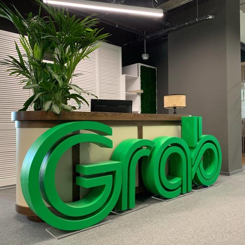 a green sign on a desk