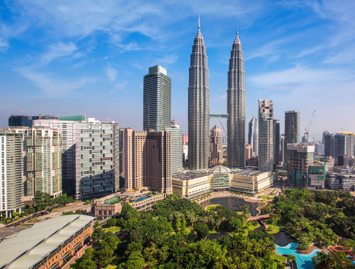 a city with tall buildings and trees