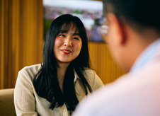 a woman smiling at a man