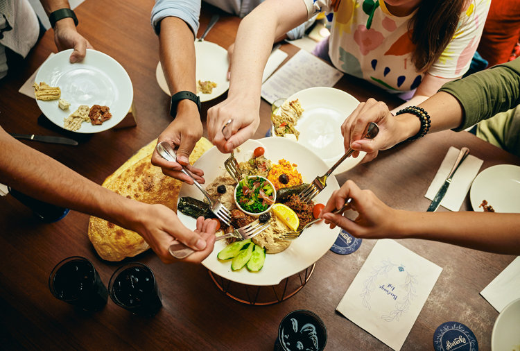 a group of people eating food