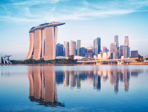 a city skyline with a body of water