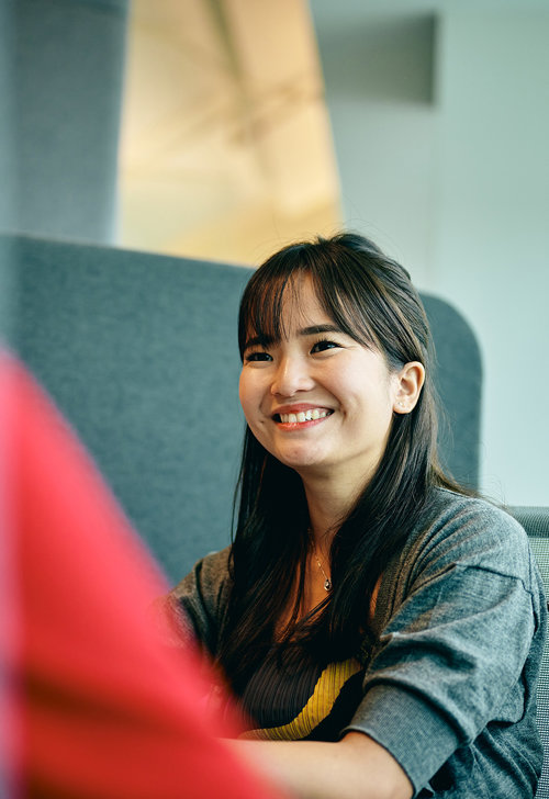 a woman smiling at someone