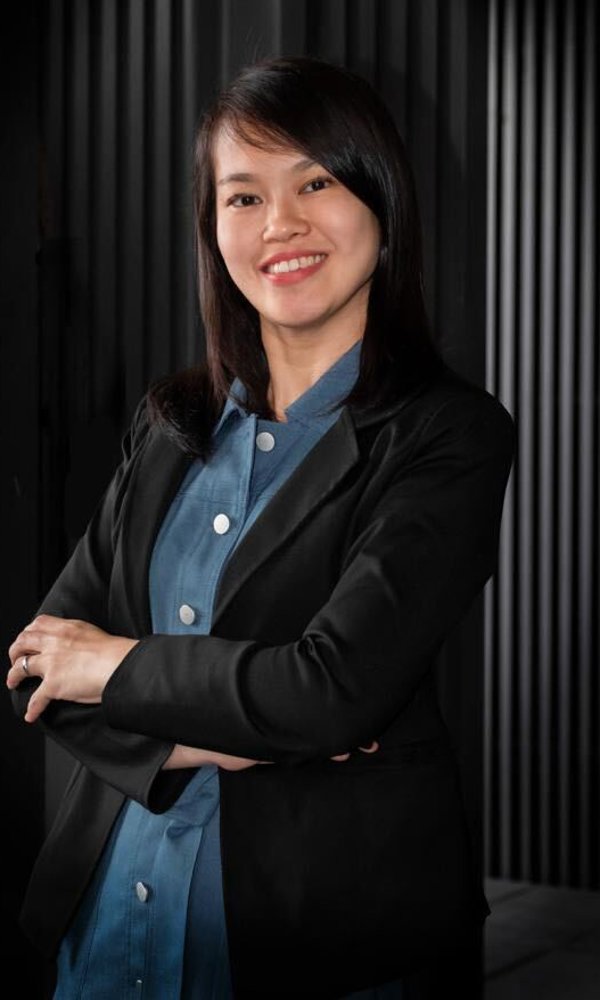 a woman in a black suit