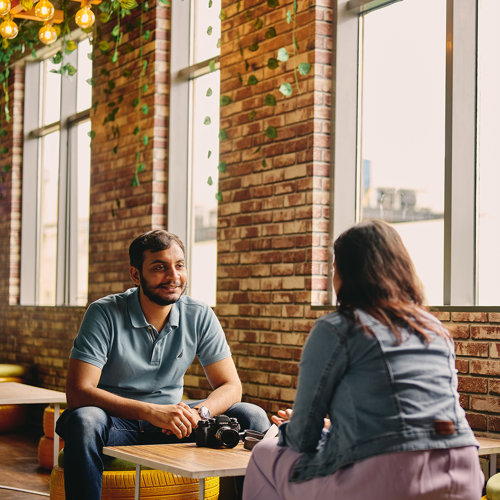 a man and woman sitting at a table