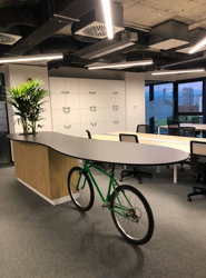 a bicycle on a table in an office