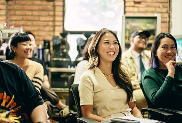 a group of people sitting in chairs