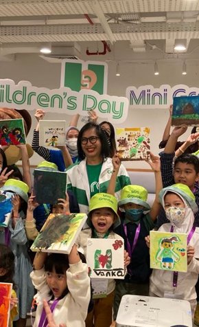 a group of children holding up signs