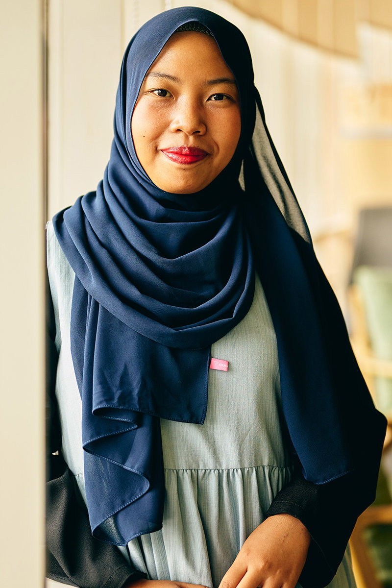 a woman wearing a blue scarf