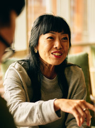 a woman smiling at a man