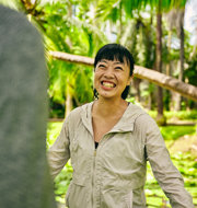 a woman smiling at another man