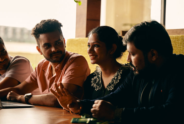 a group of people sitting at a table