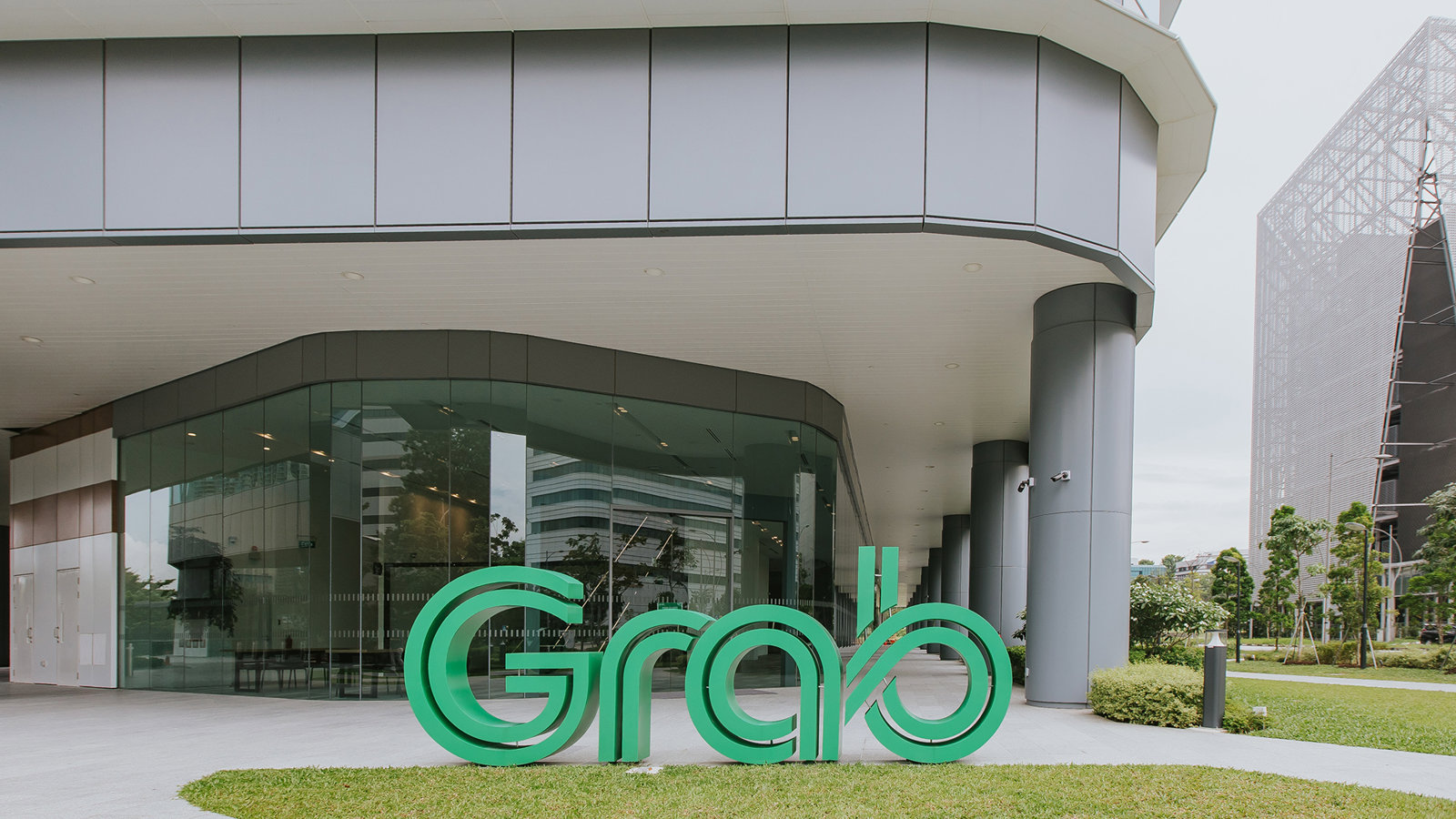 a large green sign outside of a building
