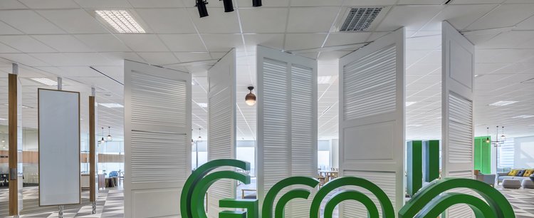 a room with white folding doors and green letters