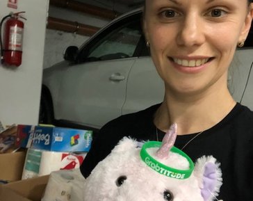 a woman holding a stuffed animal