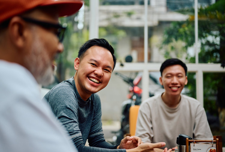 a group of men sitting at a table