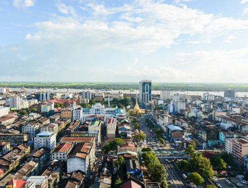 a city with many buildings and a road