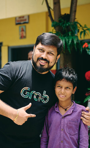 a man and two boys posing for a picture