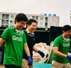 a group of people wearing green shirts and goggles